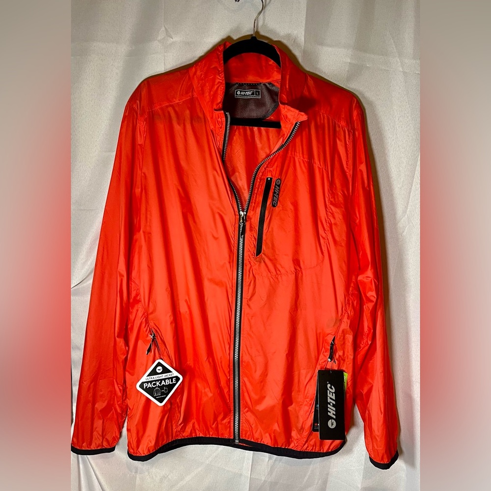NWT Hi Tech packable jacket. Mens Size Large. Orange.